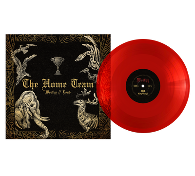 A translucent red sustainable vinyl record by The Home Team is partially out of its black and gold cover, which displays “The Home Team - Worthy // Lord” with ornate animal and trophy illustrations.