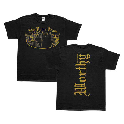 image of front and back of black tshirt. front has oval graphic in gold color that says the home team and below that is an image of 4 cats. the back in vertical text says "the home team" in small text, and the word "worthy" in large text.