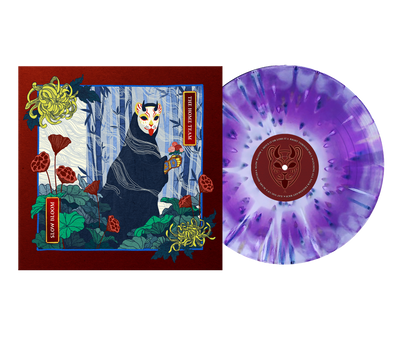 A vibrant album cover by The Home Team features a cloaked figure in a fox mask surrounded by lush plants. Beside it sits a limited edition 12" purple and white marbled vinyl, with a fox mask illustration on the label.